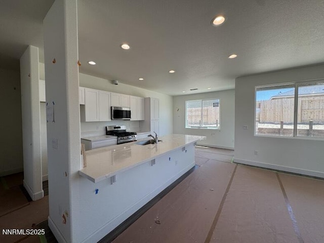 847 Agate Way, Fernley, NV 89408 - kitchen with stainless steel appliances, recessed lighting, and white cabinetry