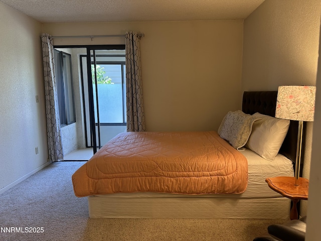 3095 Lakeside Dr # 103, Reno, NV 89509 - carpeted bedroom featuring access to outside and a textured wall