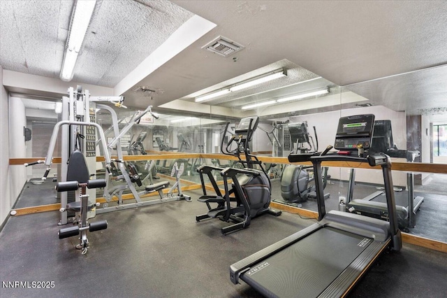 3095 Lakeside Dr # 103, Reno, NV 89509 - gym featuring a textured ceiling