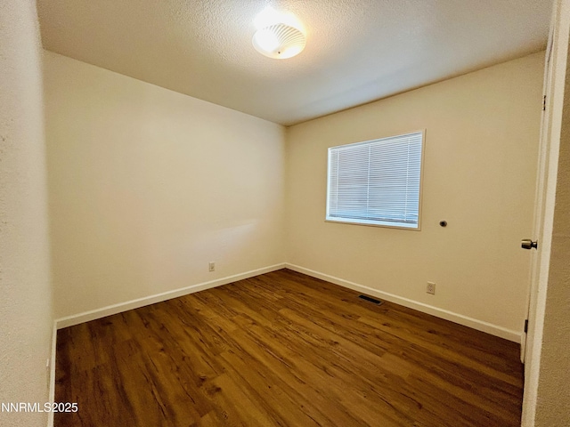 4040 Placer Way, Winnemucca, NV 89445 - unfurnished room with dark wood finished floors and baseboards