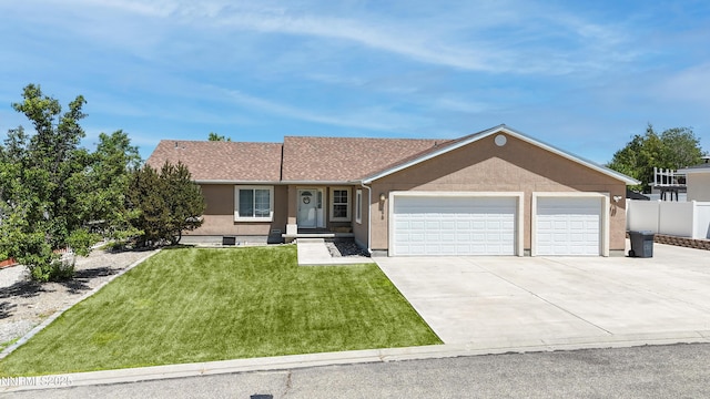 5875 Brooke Dr, Winnemucca, NV 89445 - ranch-style house featuring an attached garage, driveway, and stucco siding