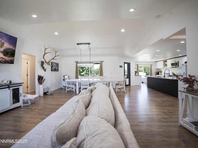 5875 Brooke Dr, Winnemucca, NV 89445 - living area with lofted ceiling, recessed lighting, and dark wood-style floors