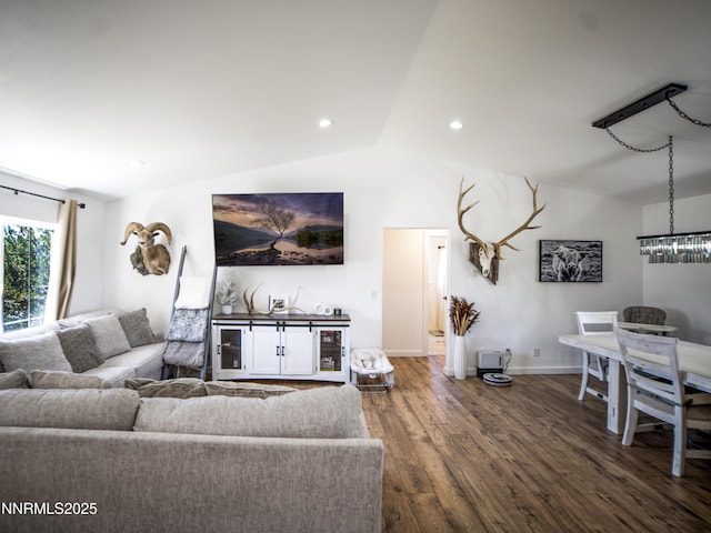 5875 Brooke Dr, Winnemucca, NV 89445 - living area featuring dark wood-style floors, vaulted ceiling, a chandelier, and recessed lighting