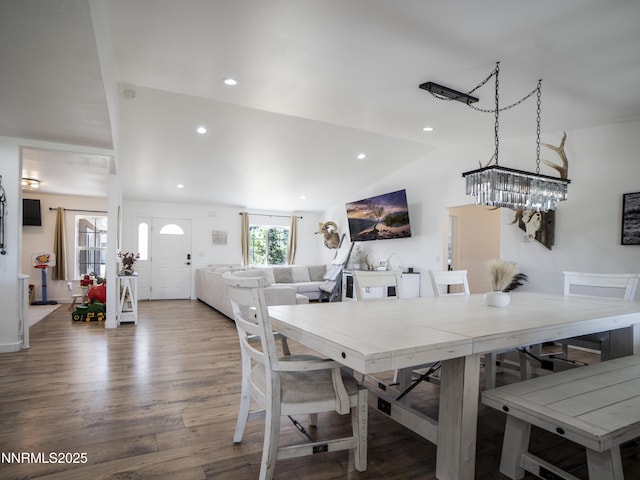 5875 Brooke Dr, Winnemucca, NV 89445 - dining space featuring a chandelier, wood finished floors, vaulted ceiling, and recessed lighting