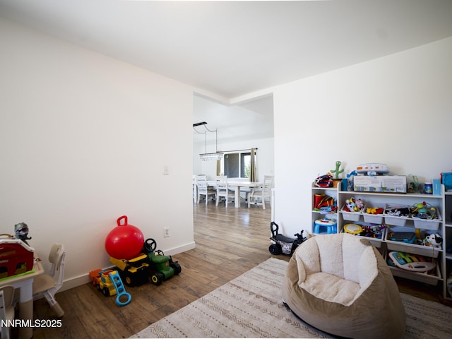 5875 Brooke Dr, Winnemucca, NV 89445 - living area featuring wood finished floors and a chandelier