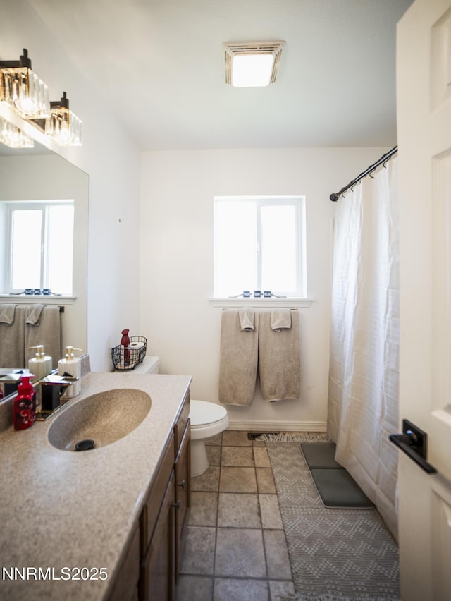 5875 Brooke Dr, Winnemucca, NV 89445 - bathroom with vanity, plenty of natural light, and a shower with shower curtain