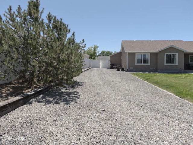 5875 Brooke Dr, Winnemucca, NV 89445 - view of side of property featuring a gate and driveway
