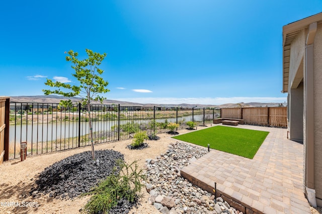 7436 Rustic Towers Dr, Sparks, NV 89441 - fenced backyard with a water view and a patio area