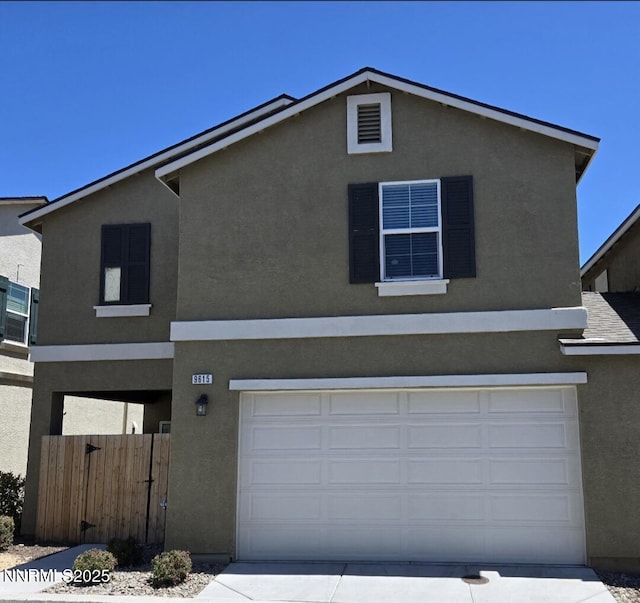 9615 Nautical Mile Rd, Reno, NV 89506 - traditional-style house featuring stucco siding, an attached garage, and concrete driveway