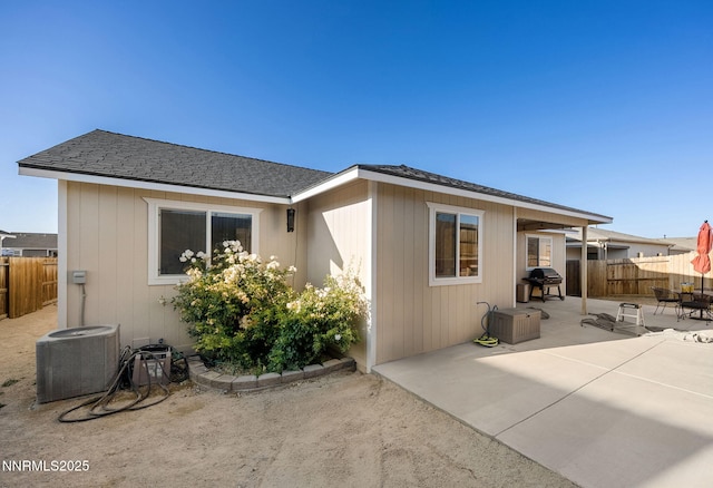 1827 Hickory Ln, Fernley, NV 89408 - rear view of house featuring a patio and roof with shingles
