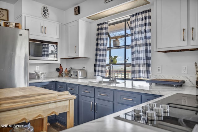 6200 Winnemucca Ranch Rd, Reno, NV 89510 - kitchen with appliances with stainless steel finishes, blue cabinetry, and white cabinets
