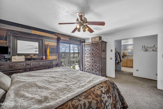 6200 Winnemucca Ranch Rd, Reno, NV 89510 - bedroom with carpet flooring, a textured ceiling, and a ceiling fan