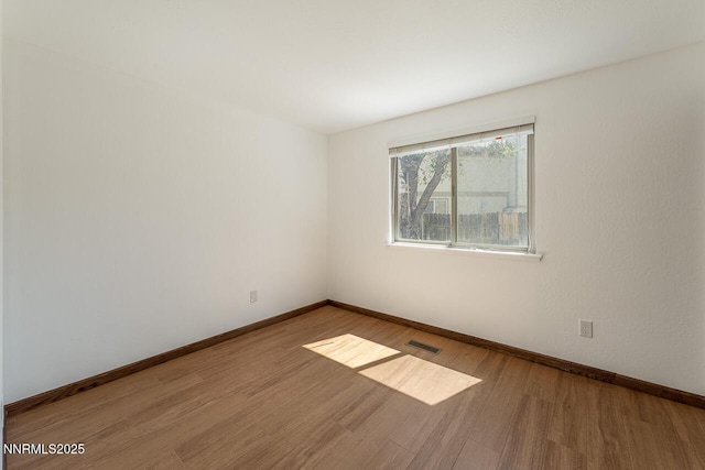 1245 Junction Ct, Sparks, NV 89434 - unfurnished room featuring wood finished floors and baseboards