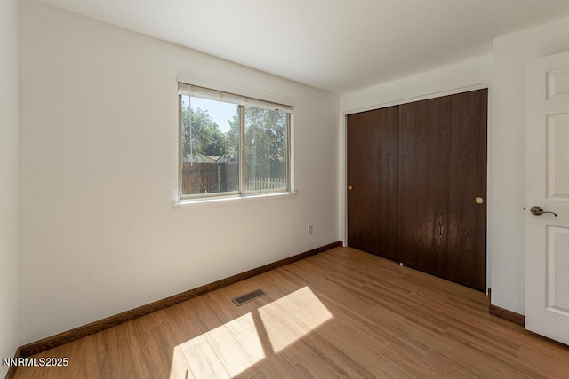 1245 Junction Ct, Sparks, NV 89434 - unfurnished bedroom with wood finished floors and a closet