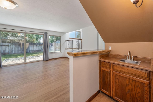 1245 Junction Ct, Sparks, NV 89434 - indoor wet bar with light wood-style flooring and a textured ceiling