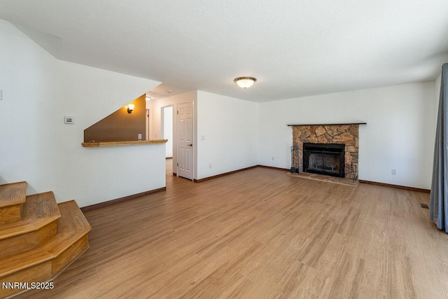 1245 Junction Ct, Sparks, NV 89434 - unfurnished living room with light wood-type flooring and a fireplace