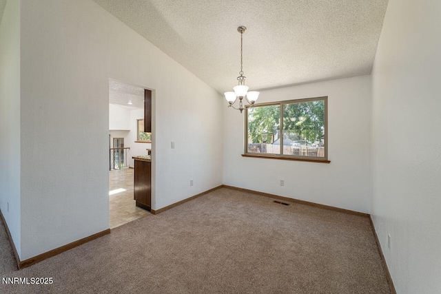 1245 Junction Ct, Sparks, NV 89434 - unfurnished room featuring carpet floors, a chandelier, a textured ceiling, and vaulted ceiling