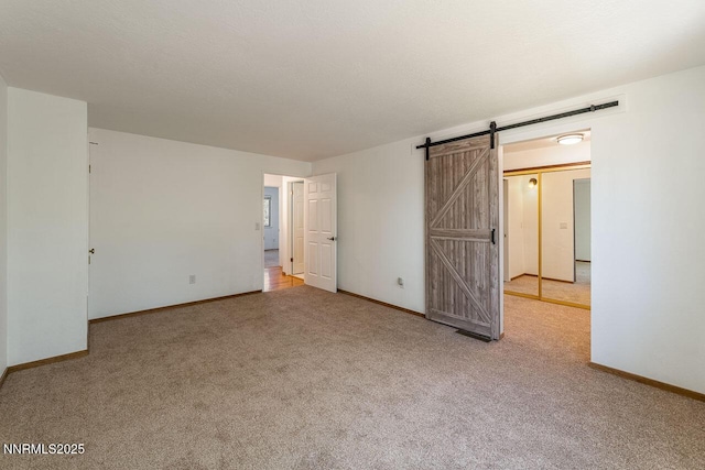 1245 Junction Ct, Sparks, NV 89434 - unfurnished bedroom featuring carpet floors and a barn door