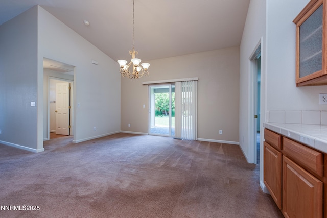 1421 Chiltern Ct, Gardnerville, NV 89410 - unfurnished dining area with a chandelier, light carpet, and vaulted ceiling