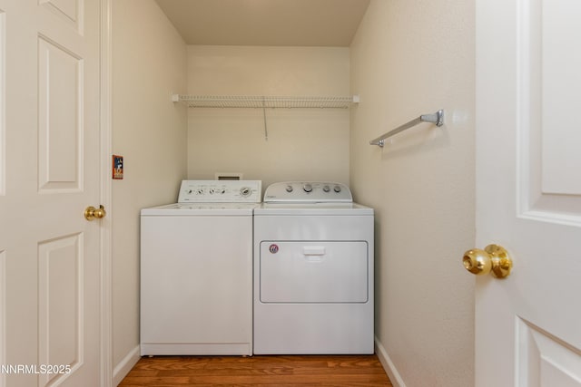 1421 Chiltern Ct, Gardnerville, NV 89410 - laundry area featuring washing machine and clothes dryer and wood finished floors