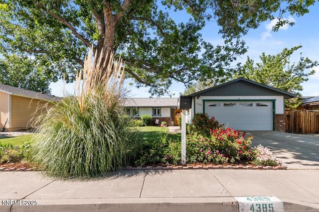 4385 Valdez Way, Reno, NV 89502 - ranch-style home featuring driveway, an attached garage, and brick siding