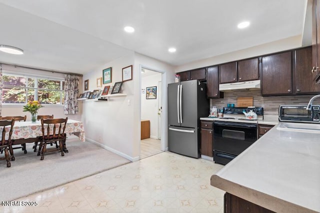 4385 Valdez Way, Reno, NV 89502 - kitchen with freestanding refrigerator, electric range oven, under cabinet range hood, dark brown cabinetry, and light countertops