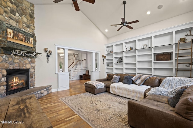 5 Connie Way, Reno, NV 89521 - living room with a fireplace, a ceiling fan, stairs, high vaulted ceiling, and wood finished floors