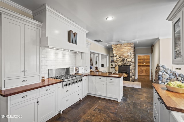 5 Connie Way, Reno, NV 89521 - kitchen featuring butcher block counters, ornamental molding, stainless steel gas cooktop, open floor plan, and a peninsula