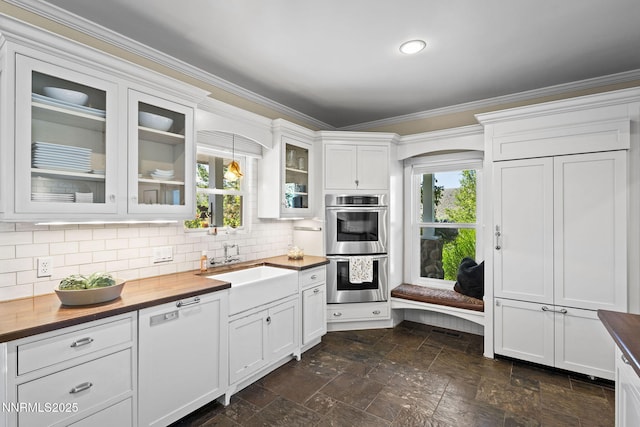 5 Connie Way, Reno, NV 89521 - kitchen with wood counters, stainless steel double oven, crown molding, stone tile flooring, and white cabinets