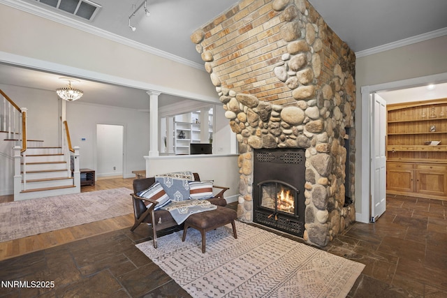 5 Connie Way, Reno, NV 89521 - living room with stairs, crown molding, stone tile flooring, a fireplace, and ornate columns