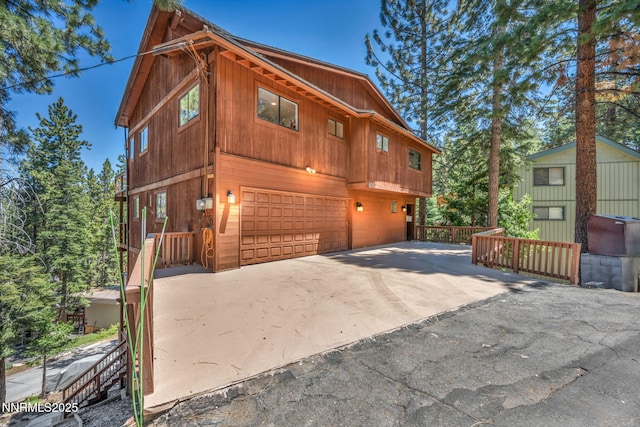 638 N Martin Dr, Zephyr Cove, NV 89448 - view of front of house featuring a garage and driveway