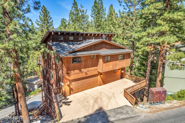 638 N Martin Dr, Zephyr Cove, NV 89448 - rustic home with driveway and a garage
