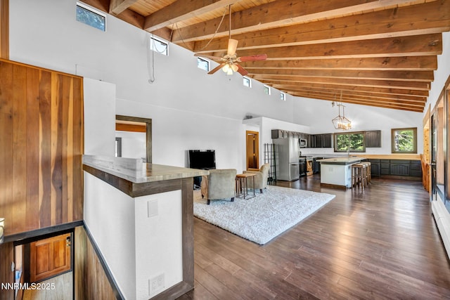 638 N Martin Dr, Zephyr Cove, NV 89448 - living area with a wooden ceiling with exposed beams, ceiling fan, high vaulted ceiling, and dark wood-style floors