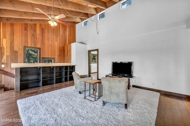 638 N Martin Dr, Zephyr Cove, NV 89448 - living area with a towering ceiling, hardwood / wood-style flooring, wooden walls, ceiling fan, and a wooden ceiling with exposed beams