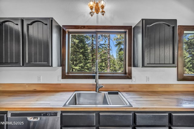 638 N Martin Dr, Zephyr Cove, NV 89448 - kitchen featuring wood counters, dishwasher, and dark cabinets