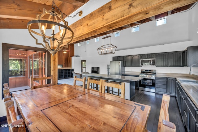 638 N Martin Dr, Zephyr Cove, NV 89448 - dining space with a chandelier, a high ceiling, beam ceiling, and dark wood-style flooring