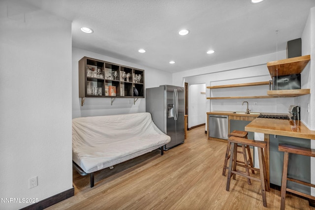 638 N Martin Dr, Zephyr Cove, NV 89448 - kitchen featuring appliances with stainless steel finishes, open shelves, wood counters, light wood-style flooring, and recessed lighting
