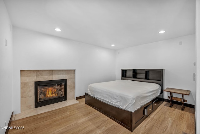 638 N Martin Dr, Zephyr Cove, NV 89448 - bedroom featuring light wood-style floors, recessed lighting, and a fireplace