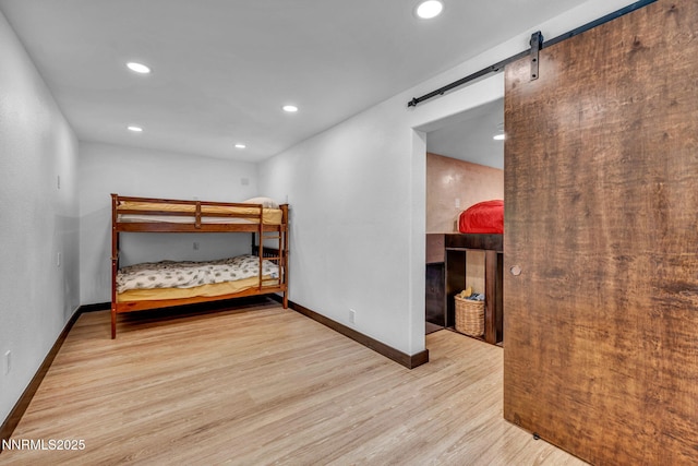 638 N Martin Dr, Zephyr Cove, NV 89448 - bedroom with a barn door, wood finished floors, and recessed lighting