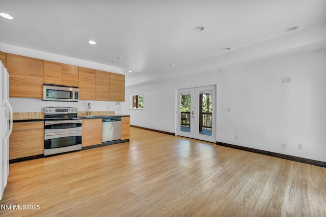 638 N Martin Dr, Zephyr Cove, NV 89448 - kitchen with stainless steel appliances, light wood-style flooring, recessed lighting, modern cabinets, and open floor plan