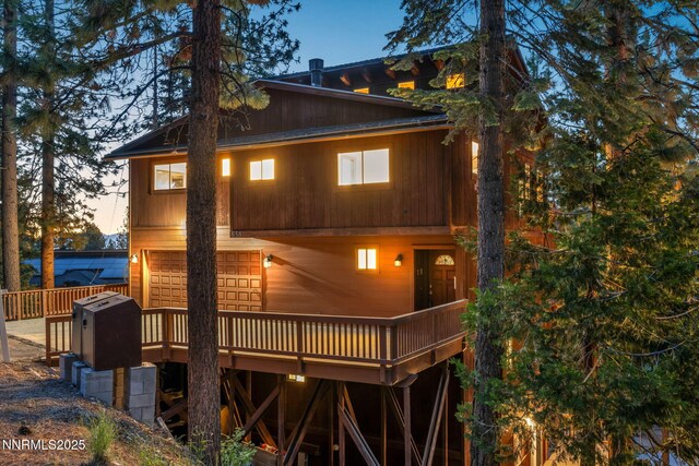638 N Martin Dr, Zephyr Cove, NV 89448 - back of house at dusk with a deck