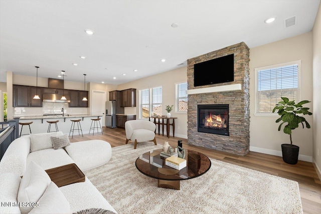 435 Gooseberry Dr, Reno, NV 89523 - living room with light wood-type flooring, a fireplace, and recessed lighting