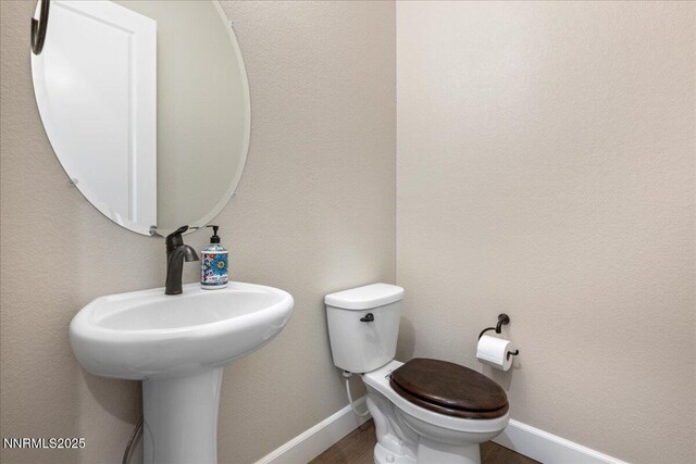 435 Gooseberry Dr, Reno, NV 89523 - bathroom featuring baseboards and toilet