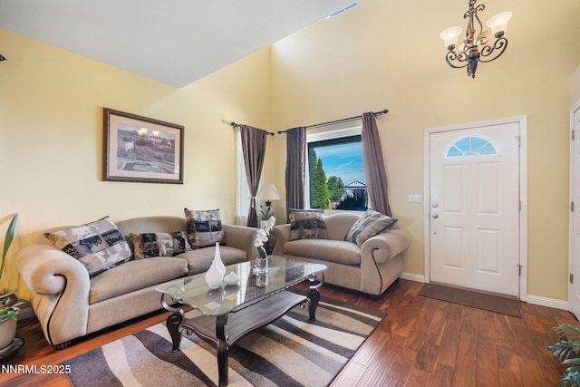 5455 Montego Ct, Reno, NV 89523 - living area with a high ceiling, dark wood finished floors, plenty of natural light, and a chandelier