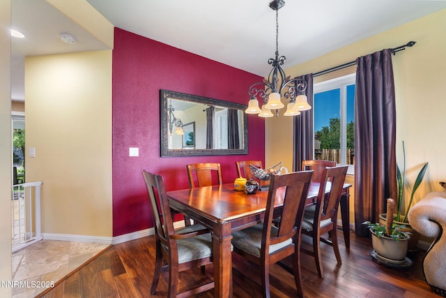 5455 Montego Ct, Reno, NV 89523 - dining area featuring a chandelier, wood finished floors, and plenty of natural light