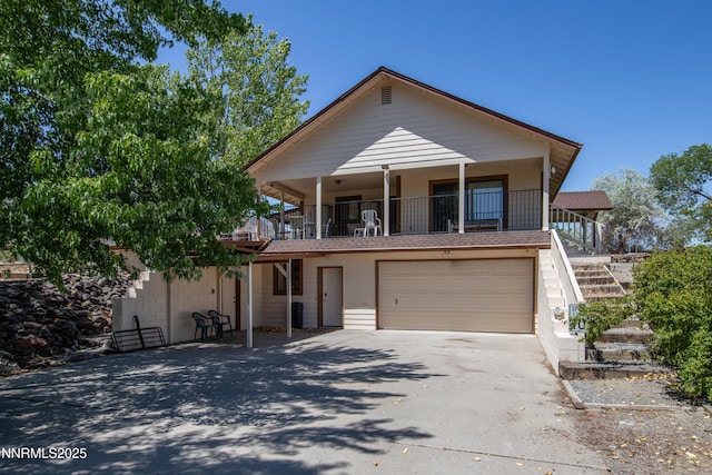 2855 Wilcox Ranch Rd, Reno, NV 89510 - view of front of home with concrete driveway, stairs, and an attached garage