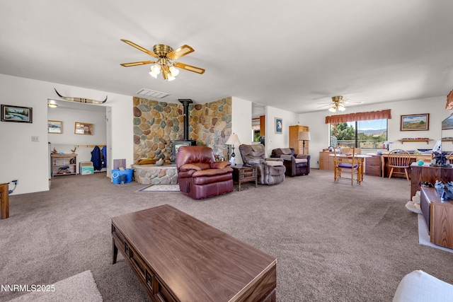 2855 Wilcox Ranch Rd, Reno, NV 89510 - living room featuring ceiling fan, a wood stove, and carpet