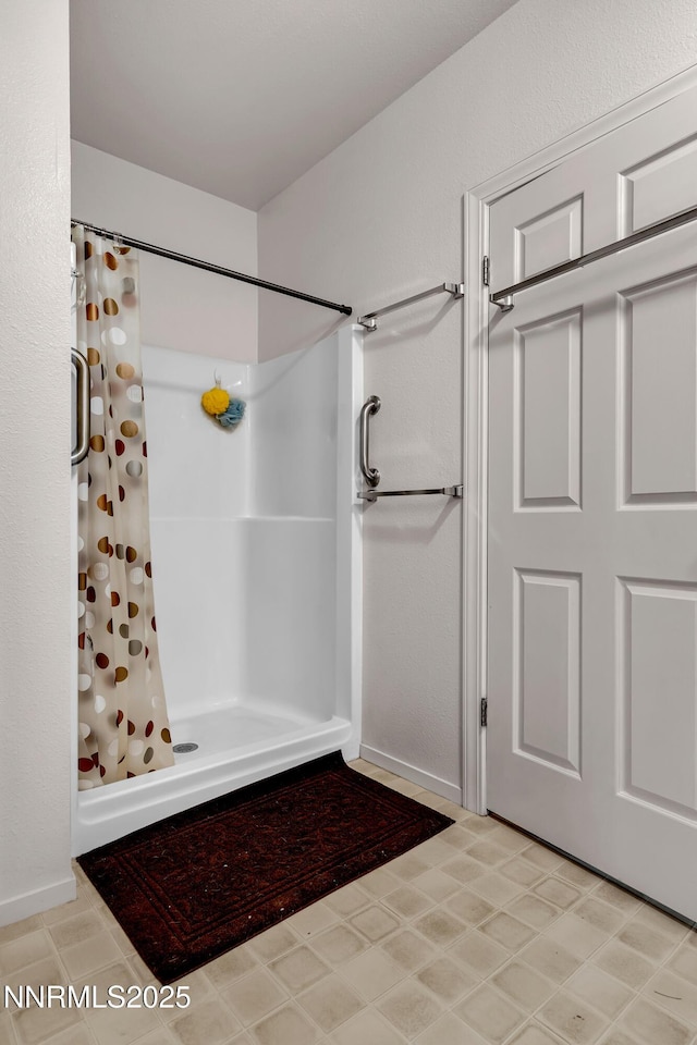 2855 Wilcox Ranch Rd, Reno, NV 89510 - bathroom featuring curtained shower and baseboards