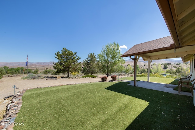 2855 Wilcox Ranch Rd, Reno, NV 89510 - view of grassy yard featuring a mountain view and a patio