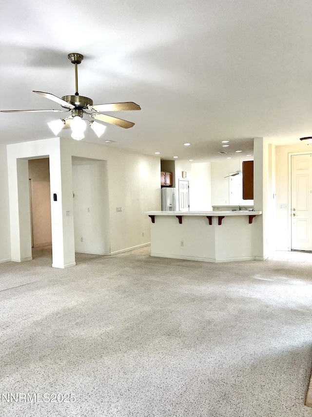 2210 Meritage Dr, Sparks, NV 89434 - unfurnished living room with ceiling fan and baseboards